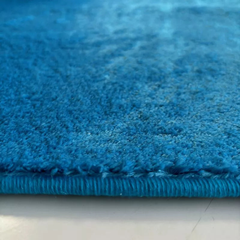 collection-tapis-bleu-Borcelino-tapis-bleu-design-modernes-élégants-pour-votre-intérieur-tapis-nuances-variées-pour-ajouter-un-style-chic-à-votre-décor